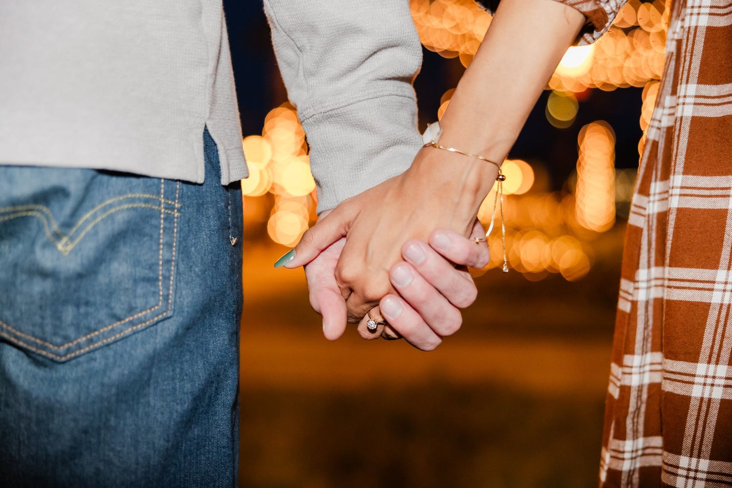 holding hands with her new ring