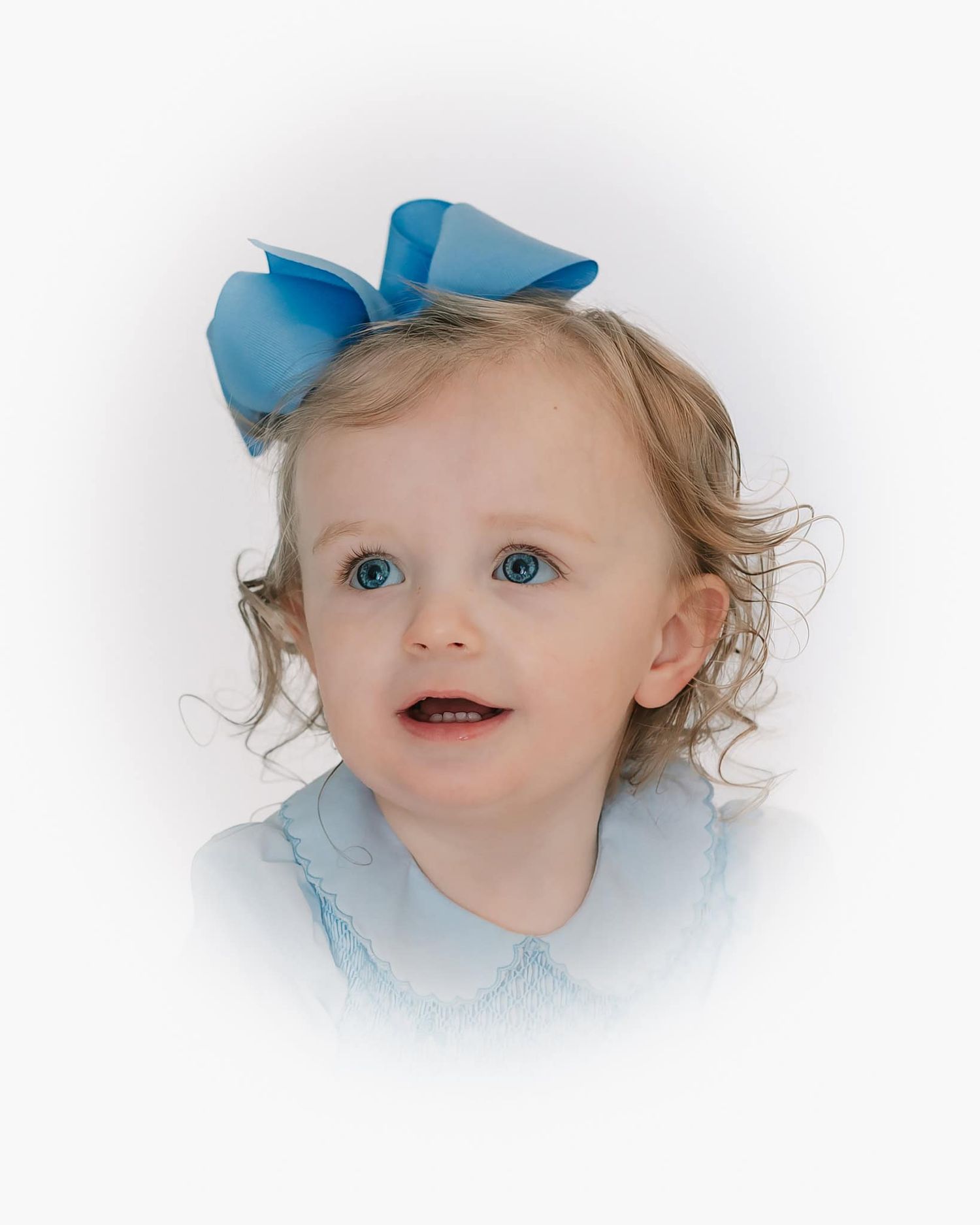 heirloom portrait or little girl in blue with curly blonde hair