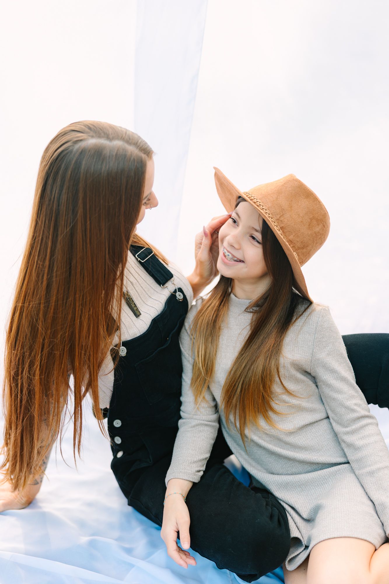 mom and daughter looking at each other admiringly