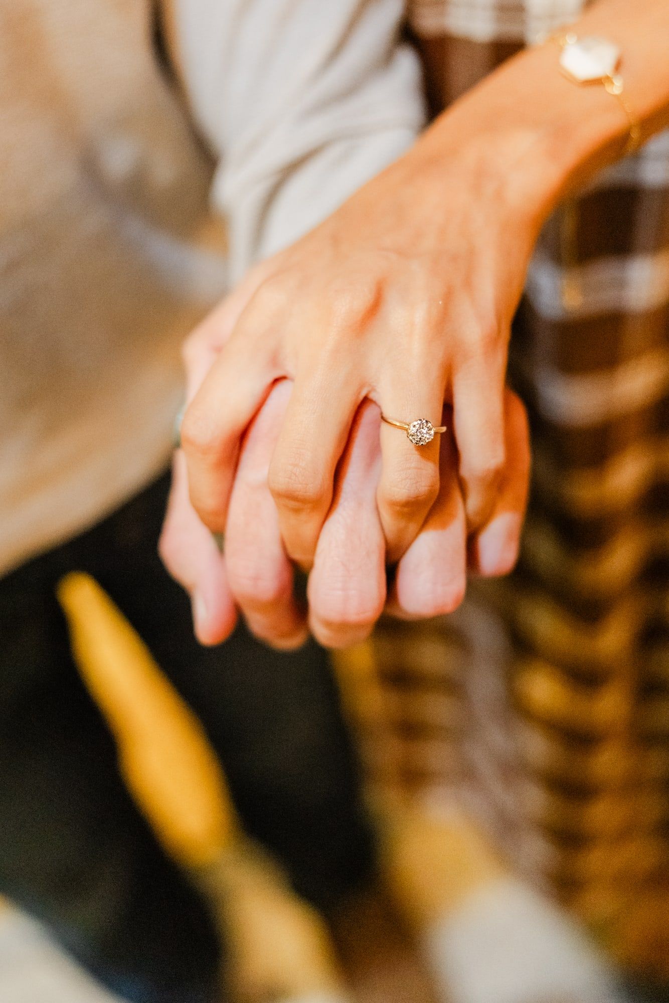hands interlocked with her new ring