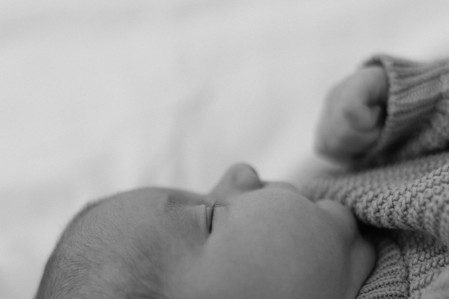 side of baby face in black and white showing shape of face and cute little nose by Jacksonville, fl photographer