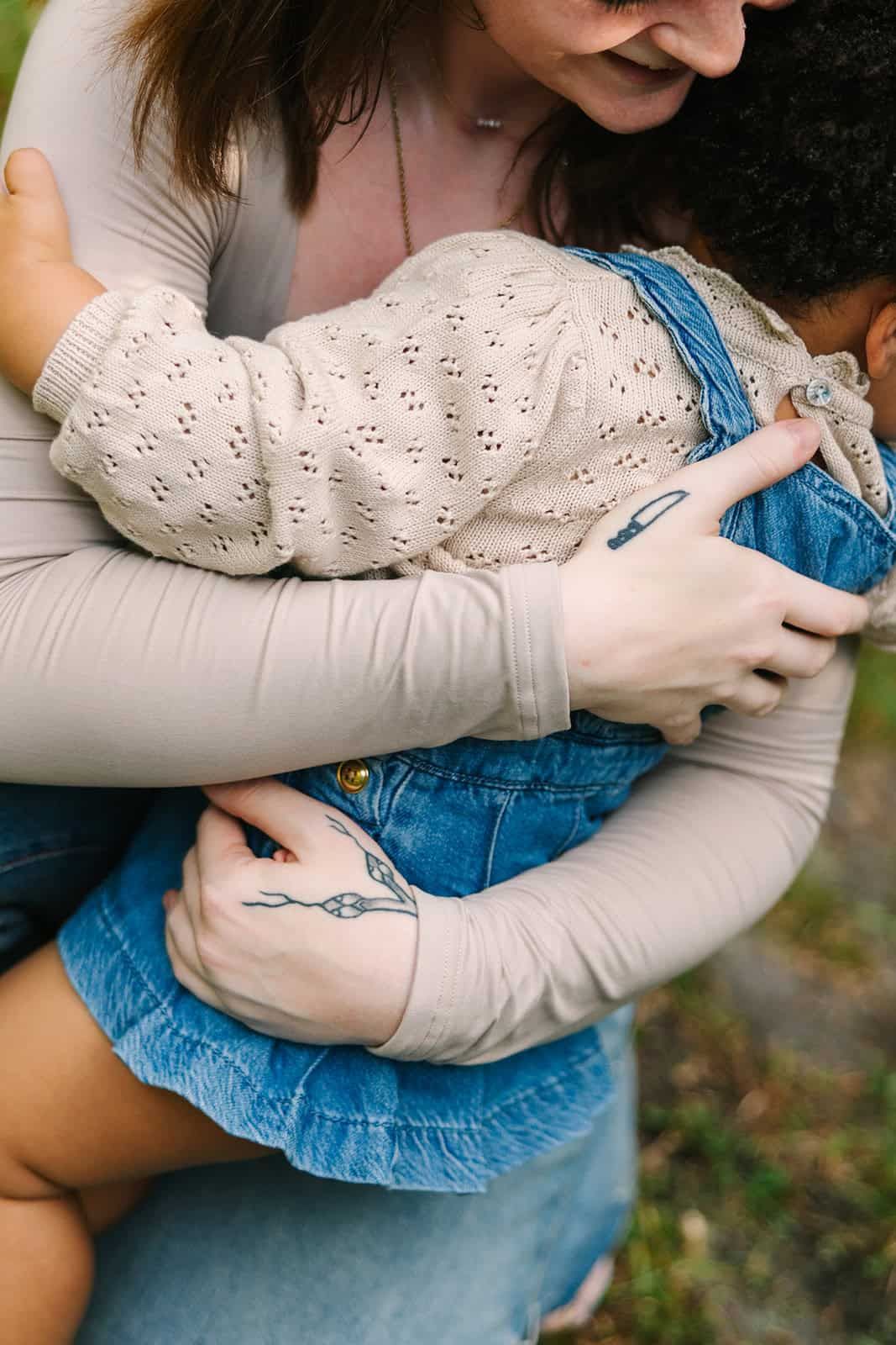close up of mama and daughter hug