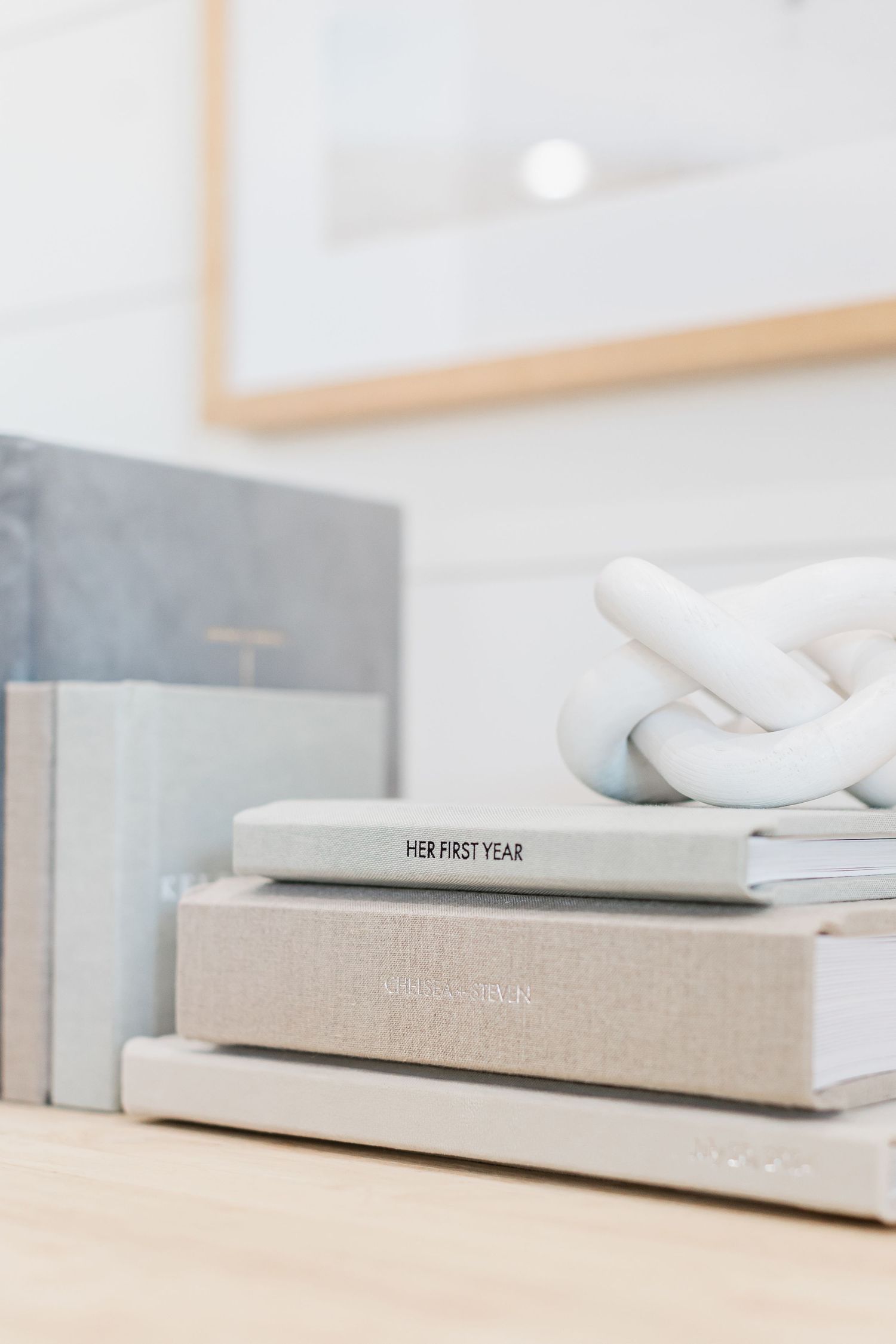 three albums stacked in order of size decoratively