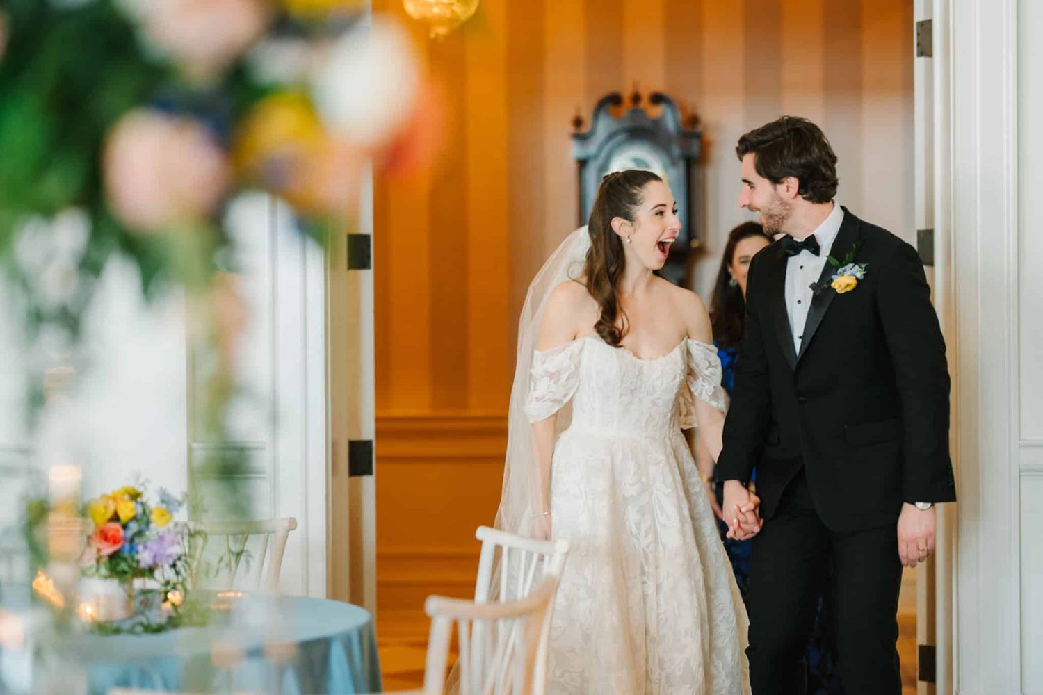 bride and groom excited as they see their reception room for the first time