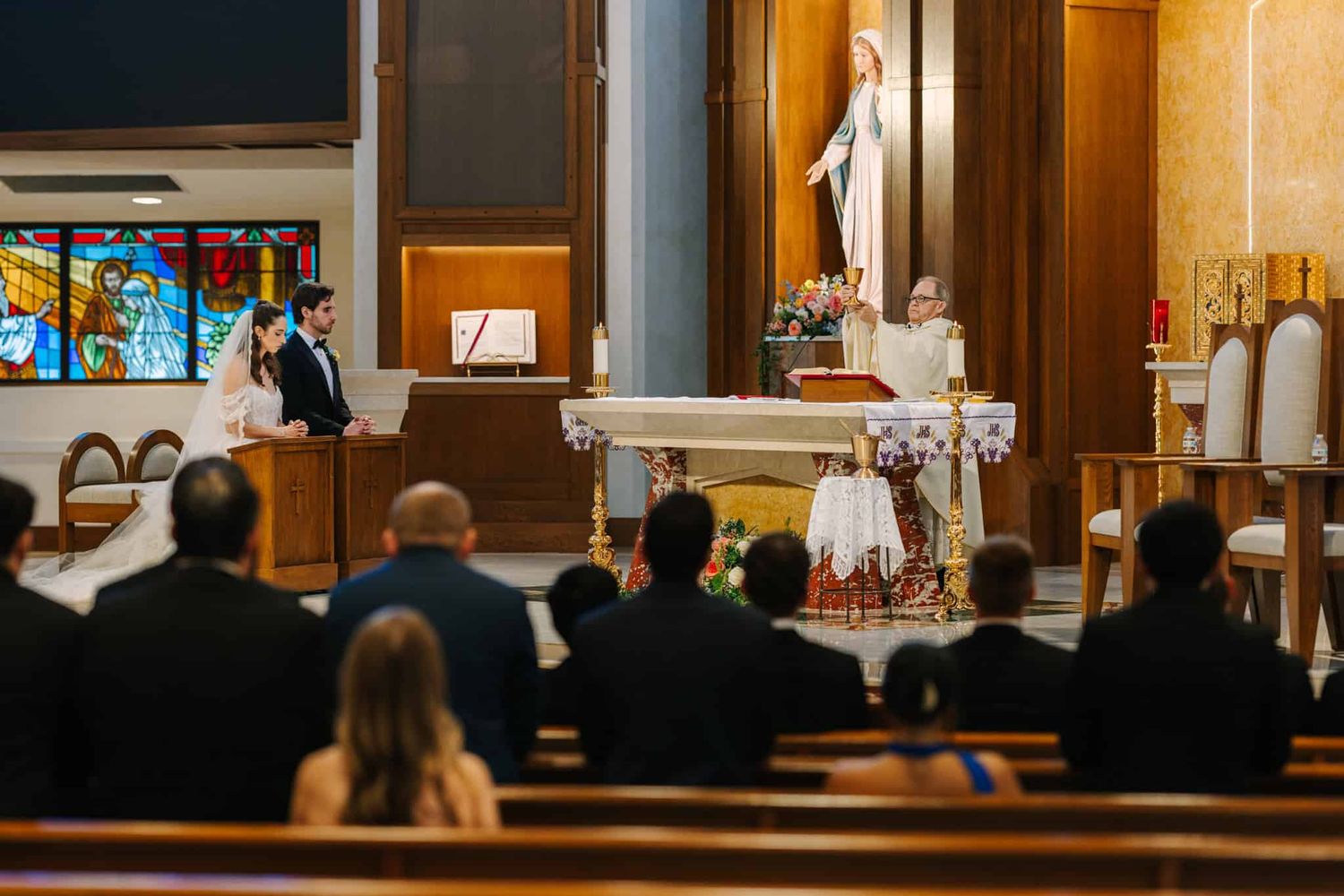 priest during mass of catholic wedding