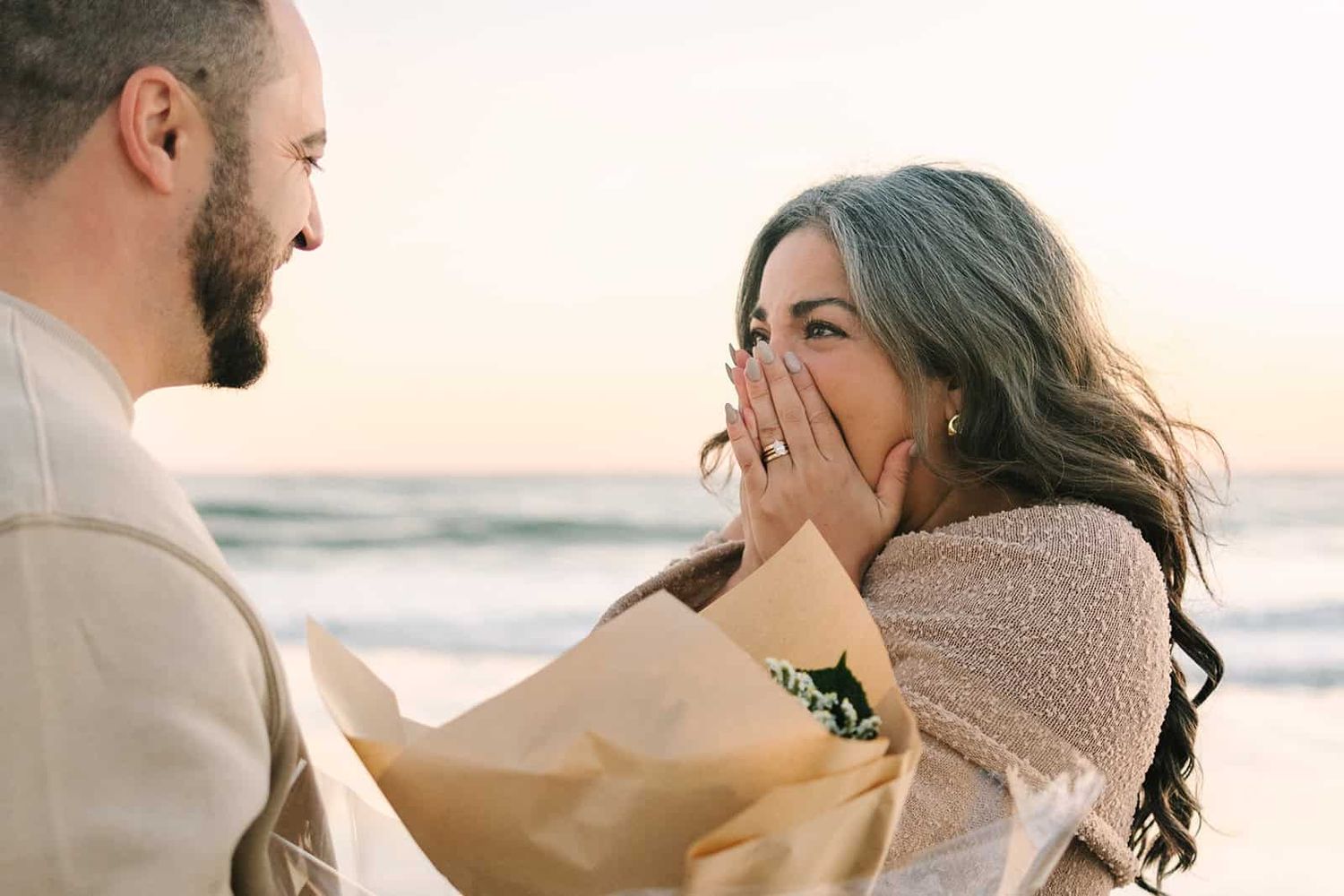 mom crying happy tears as she finds out gender of her baby from flowers