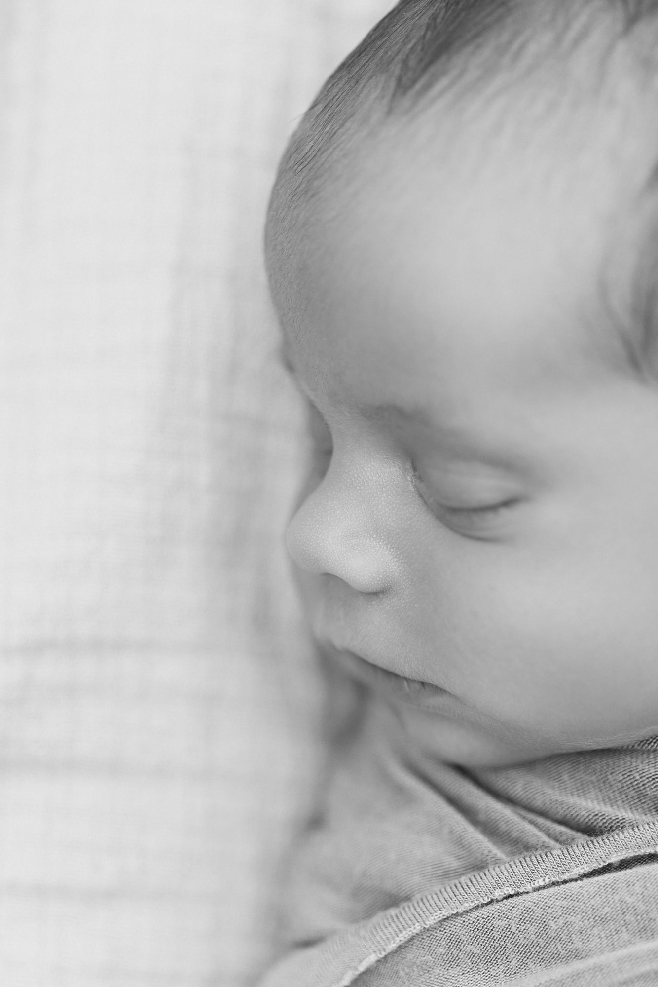 black and white newborn sleeping silhouette