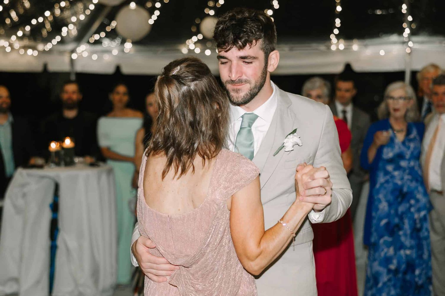 mother of the groom dancing with her son