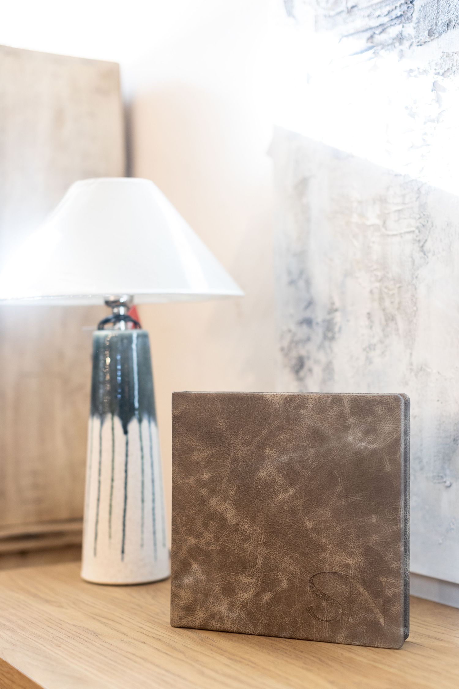 leather album next to lamp