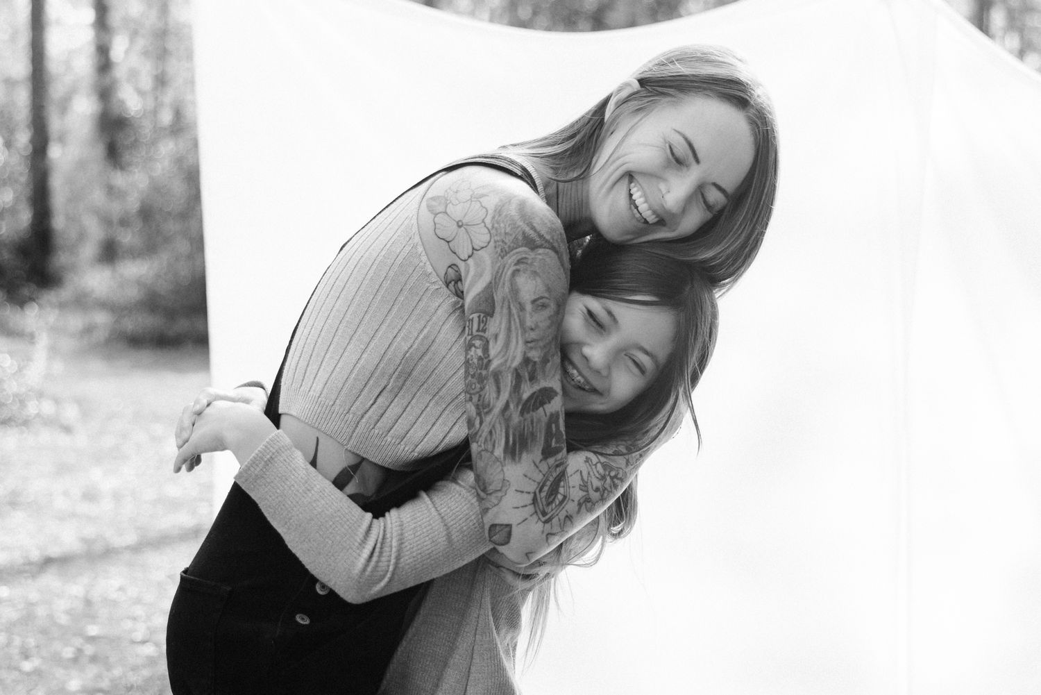 black and white mom and daughter laughing