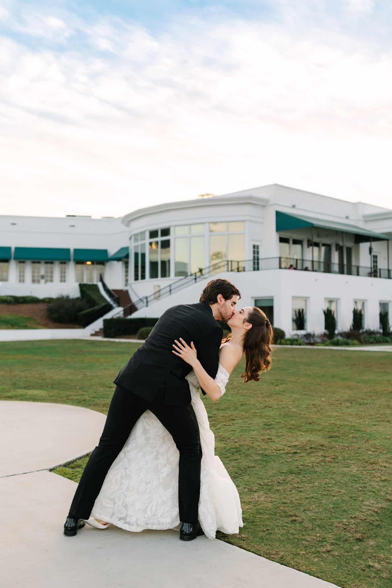 groom dipping bride for a kiss