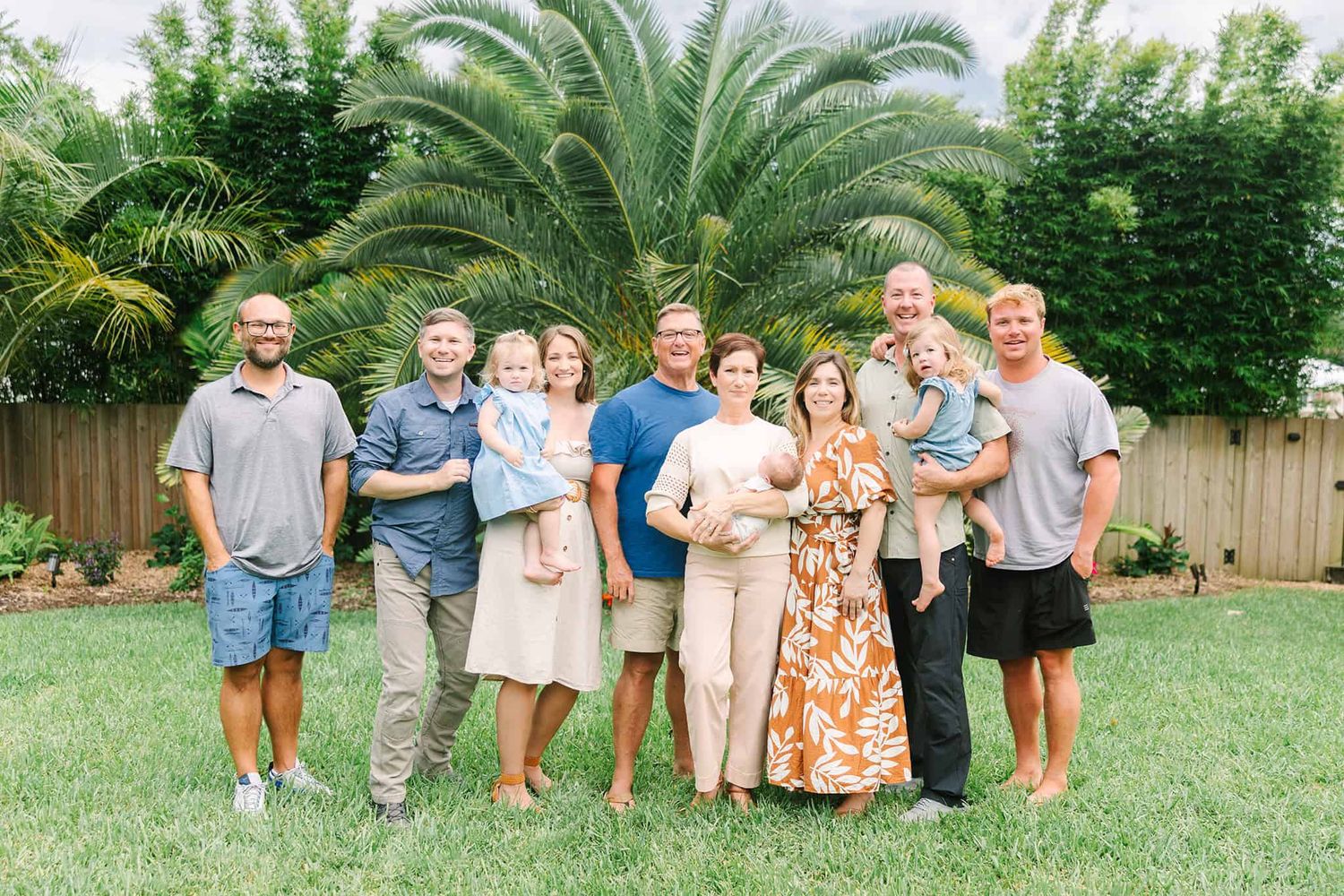 extended family with newest grandchildren in their own backyard