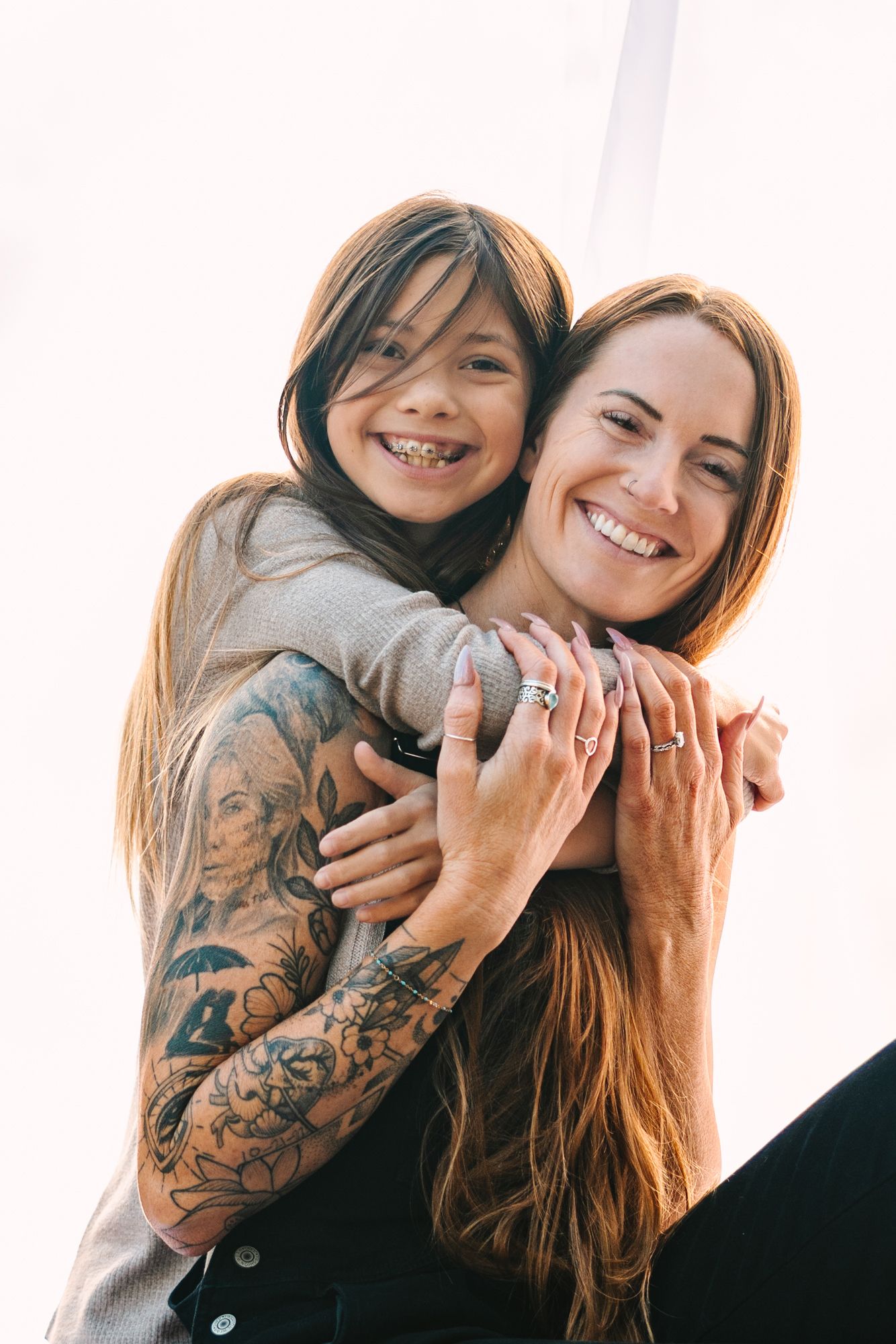 mom and daughter smiling