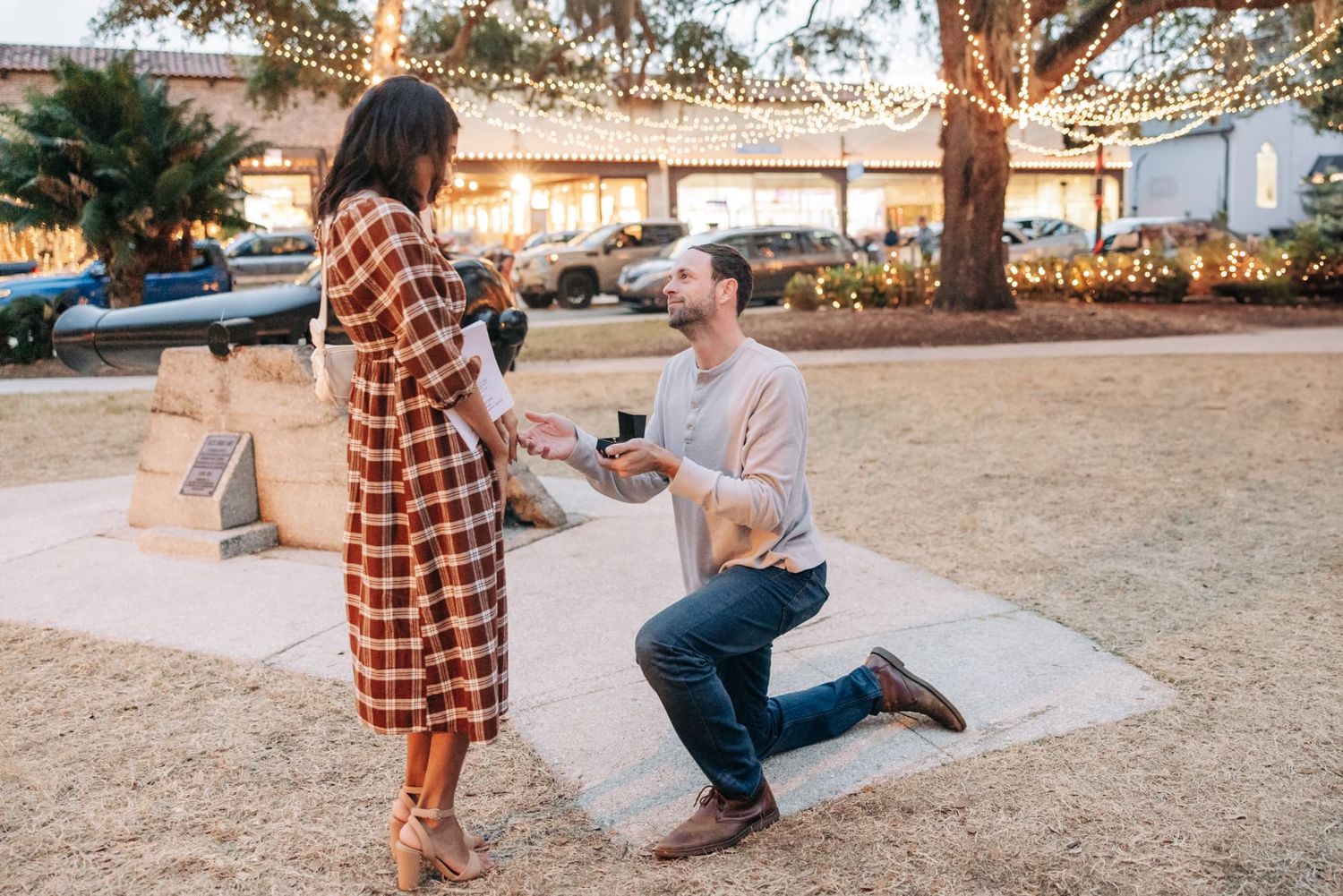 st augustine engagement photos of man proposing to woman during night of lights
