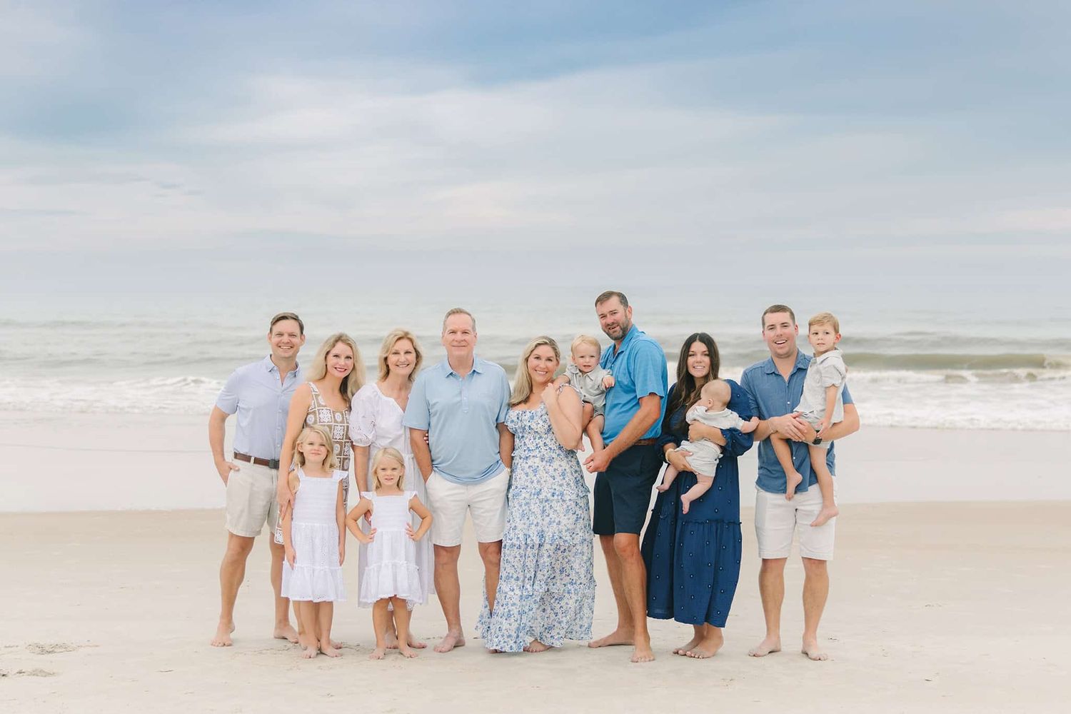 extended family in blues and whites on Jacksonville beach