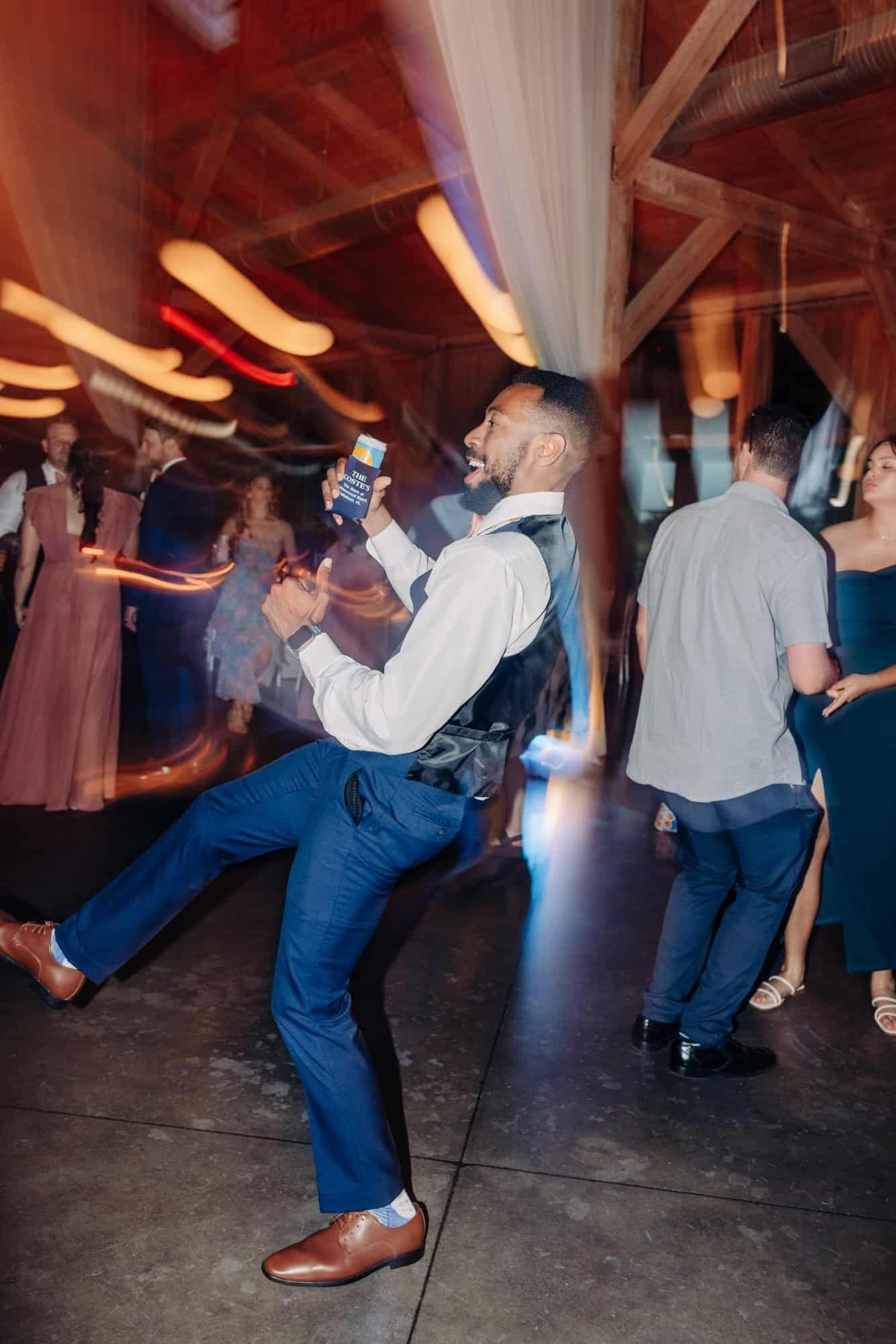 motion blur of people dancing at wedding reception