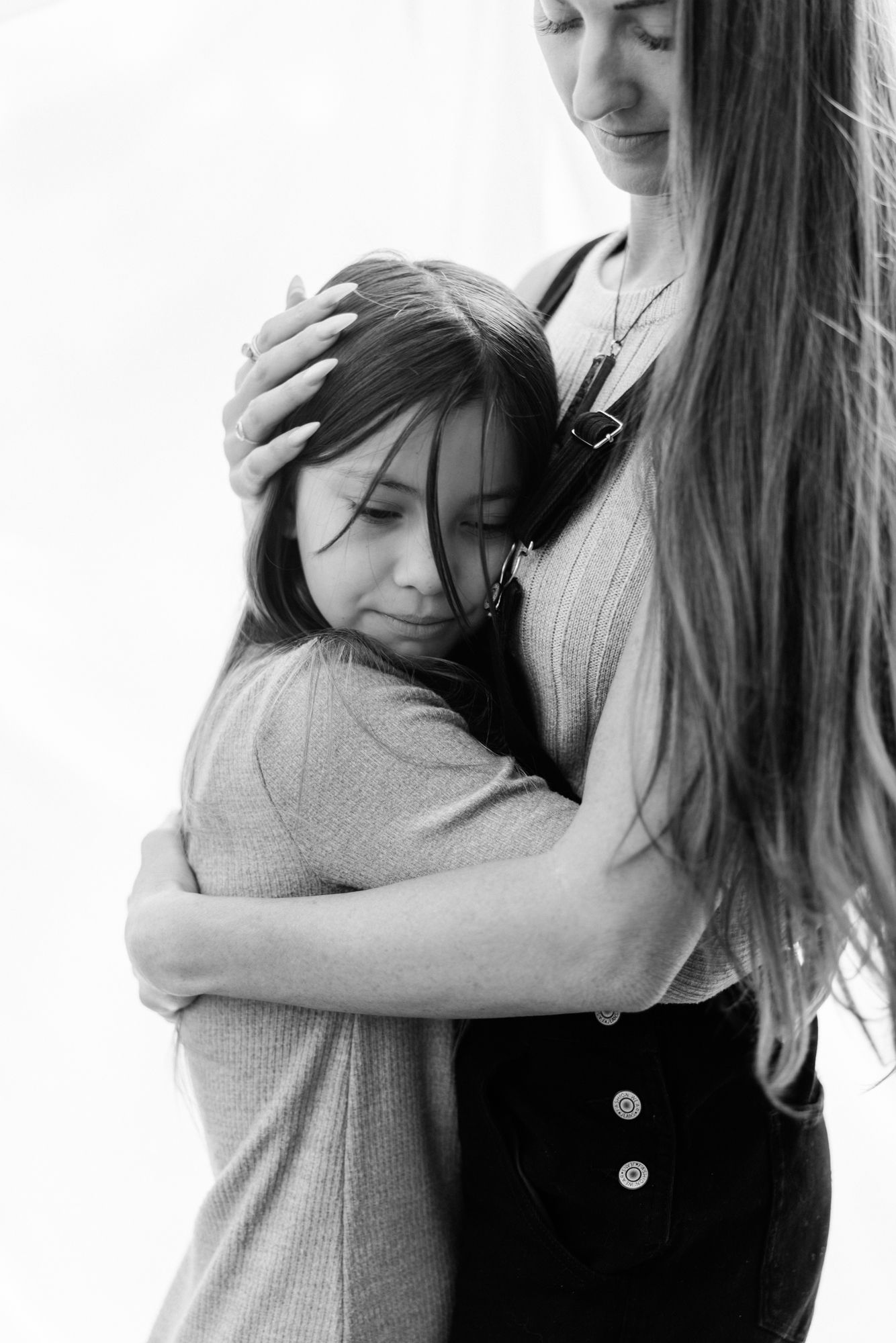 daughter snuggling into mom