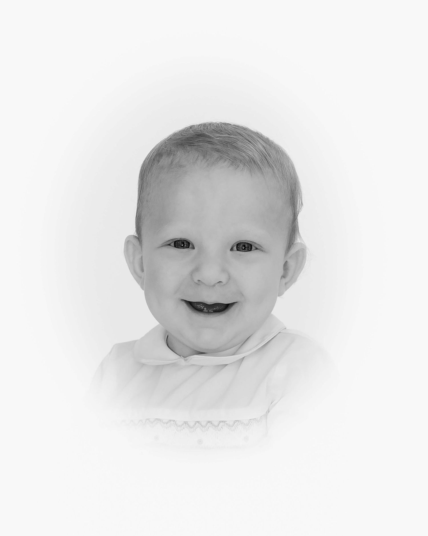 black and white heirloom portrait of little boy smiling