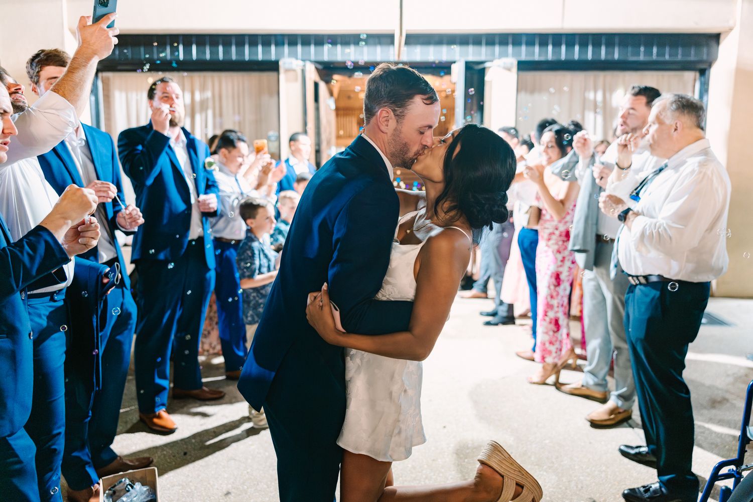 bride and groom kissing at bubble exit of wedding in Saint Augustine fl
