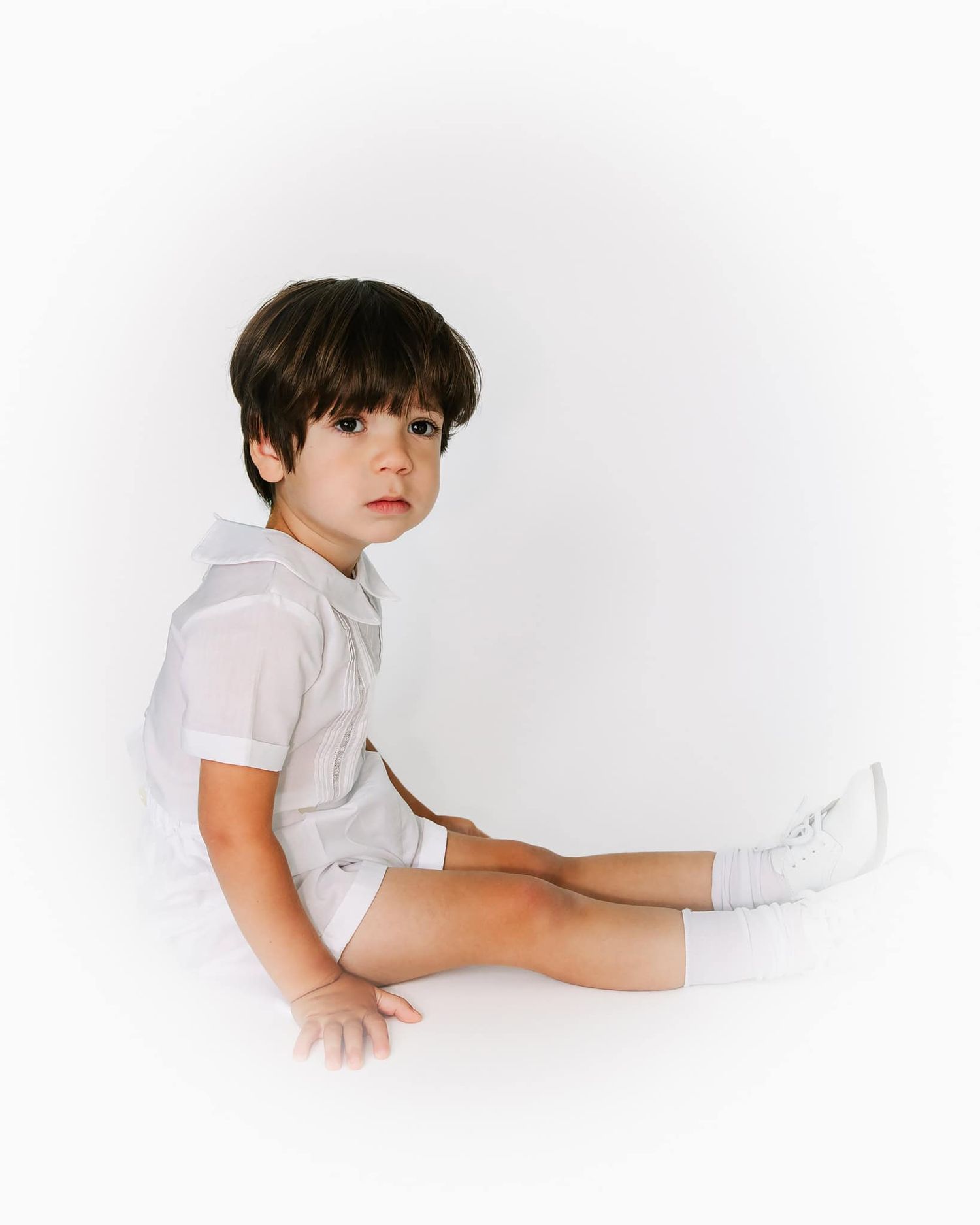 heirloom portrait in color of little boy full body sitting