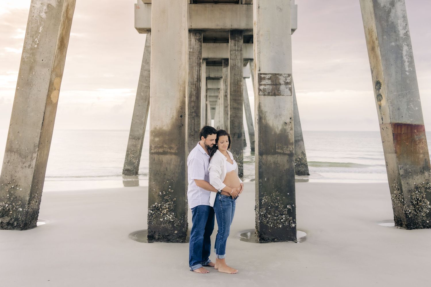 pregnant couple at jacksonville beach pier