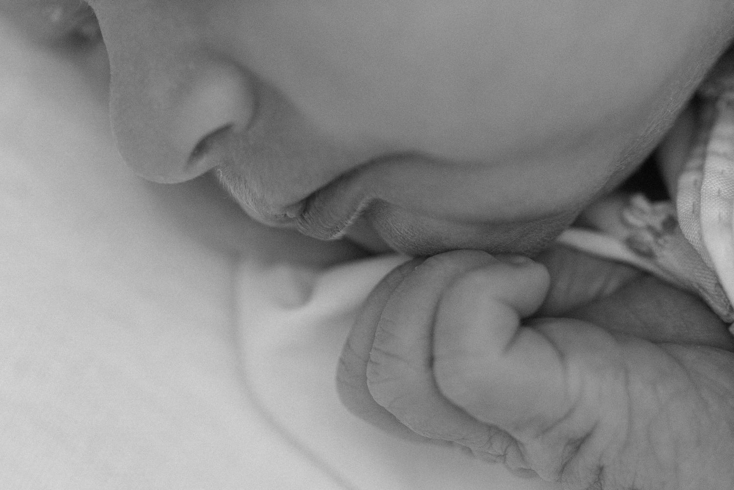 newborn baby details of her little lips and fingers