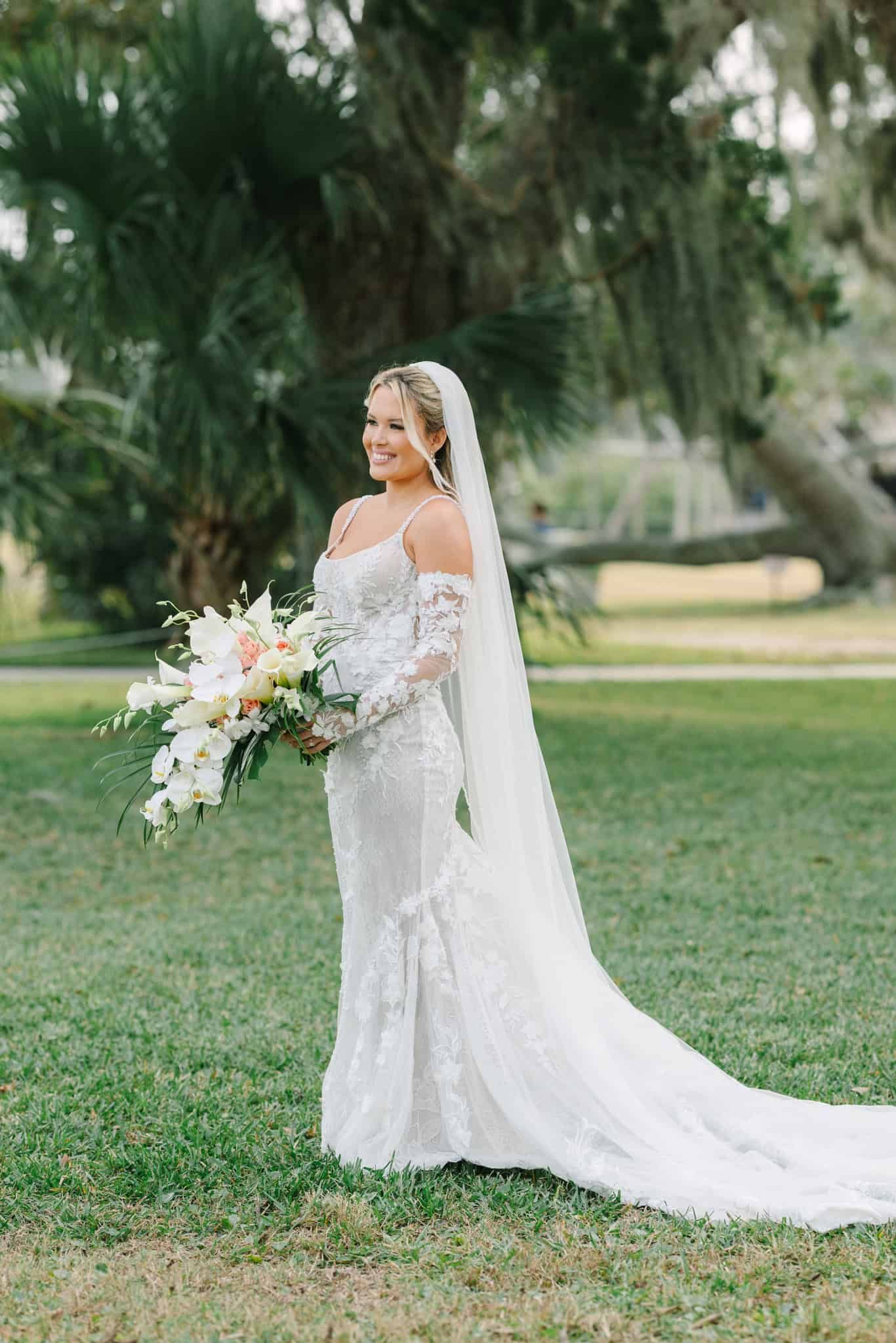 bride holding bouquet looking off to the distance