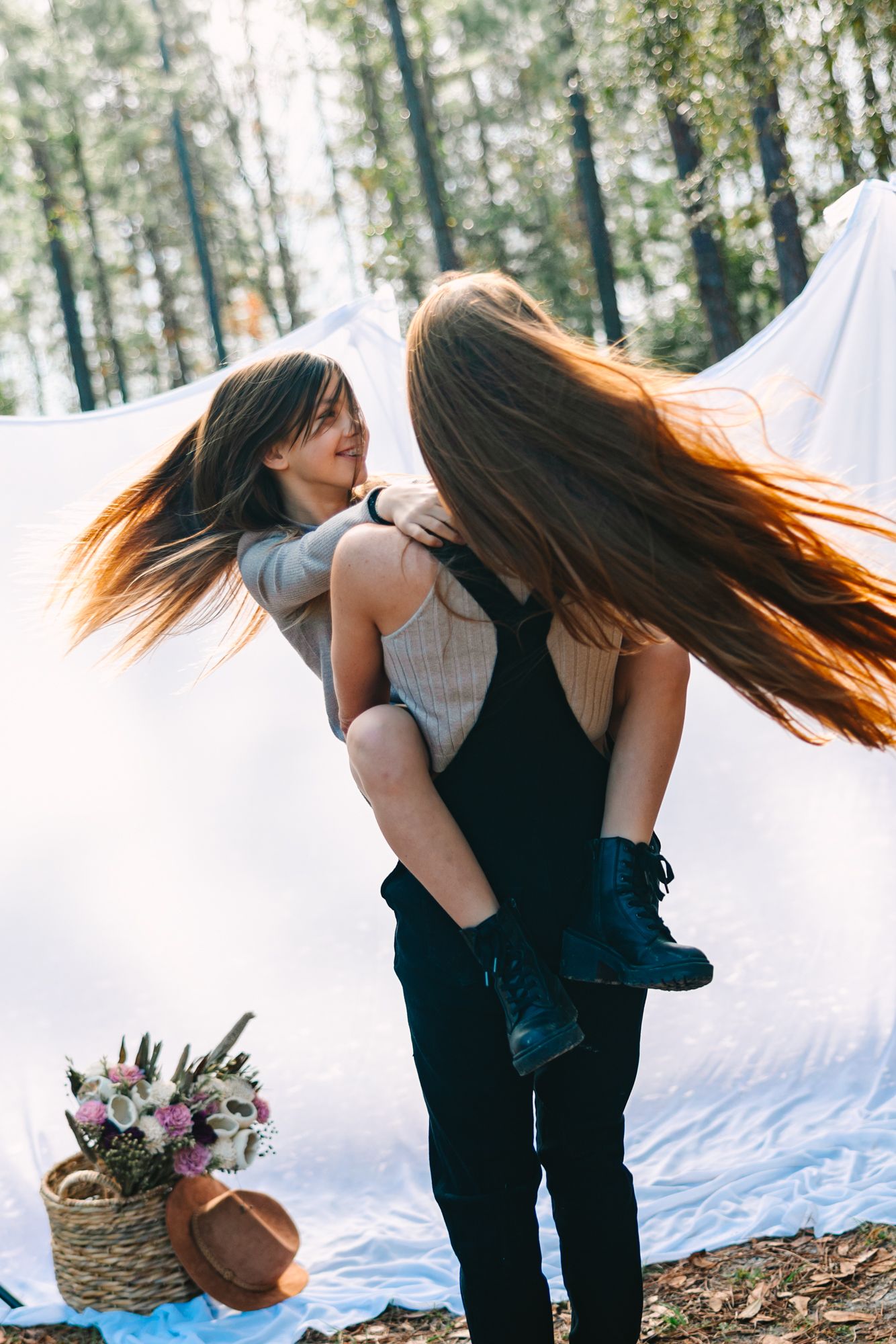 mom and daughter twirling and hair going