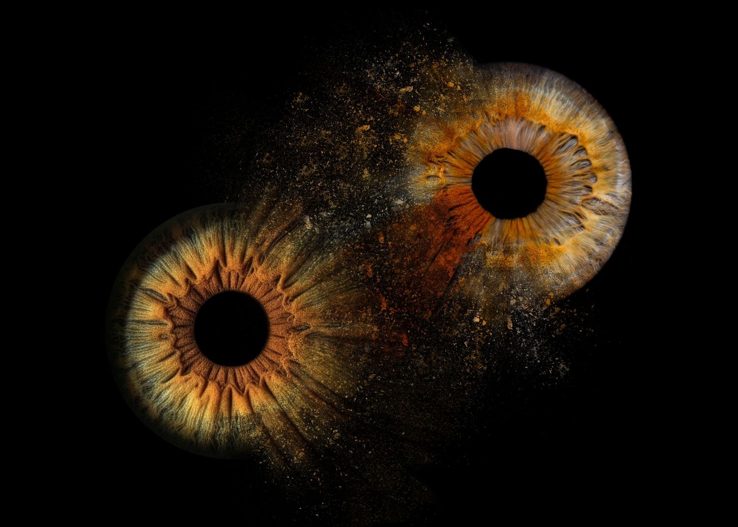 A sequence of golden iris close-ups dissolving into cosmic dust against a black background.