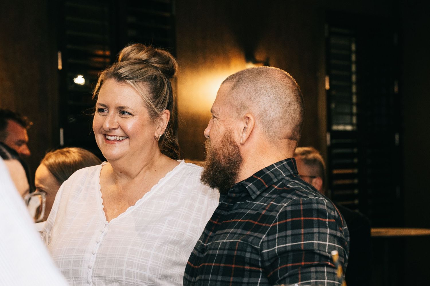 Guests enjoying themselves at a casual indoor party.