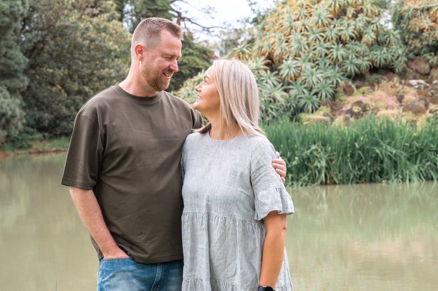 Romantic couple photos in outdoor setting with natural golden hour lighting.