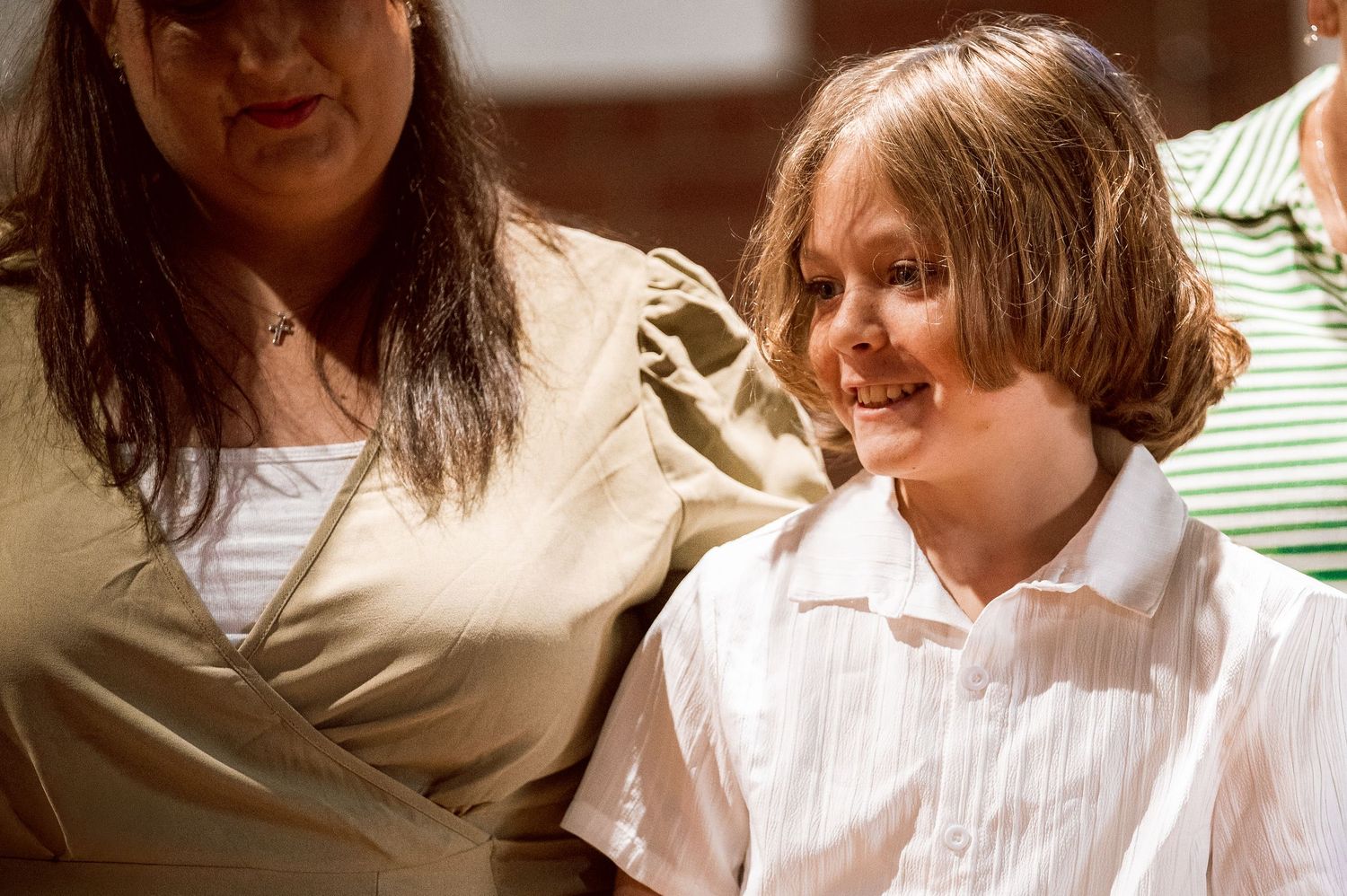 Two people share a joyful moment together during a celebration.
