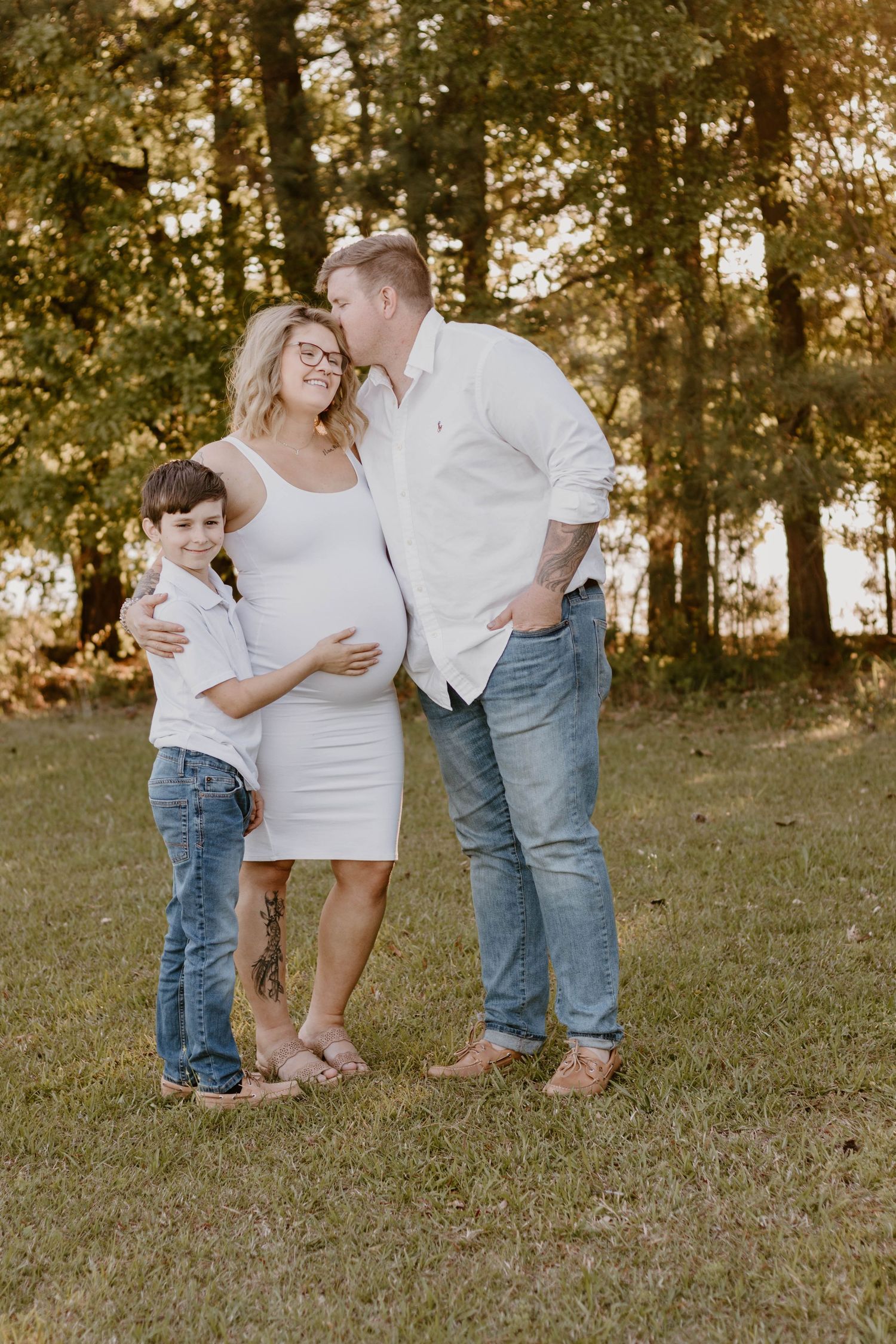 Sweet family moment captured in casual outdoor setting with natural lighting.