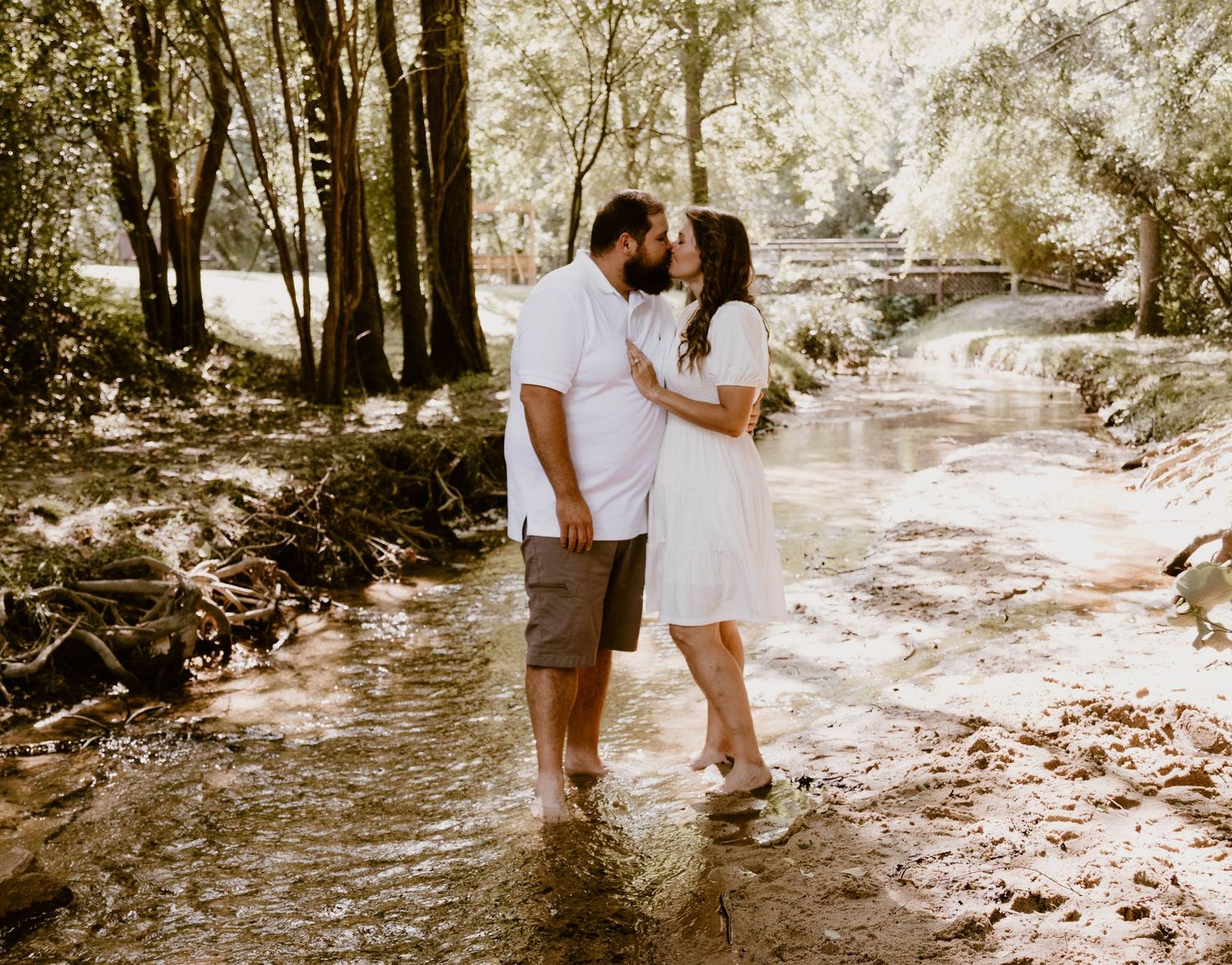 A series of romantic photos showing a couple posing together by a creek in dappled sunlight.