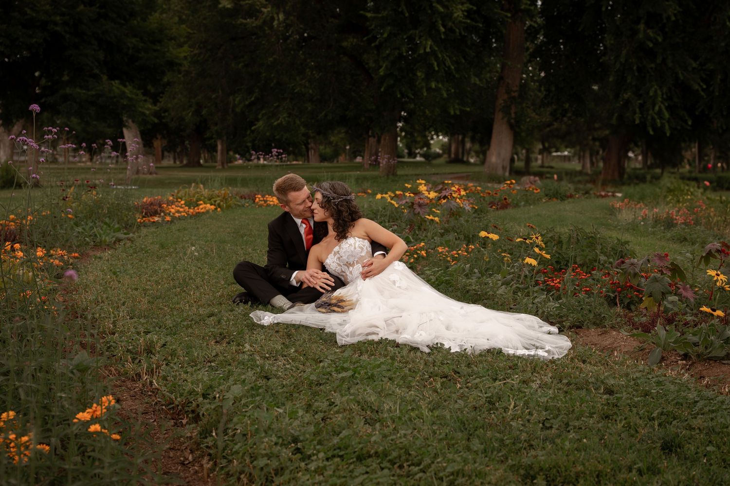 Romantic wedding photos taken in garden setting with autumn colors.