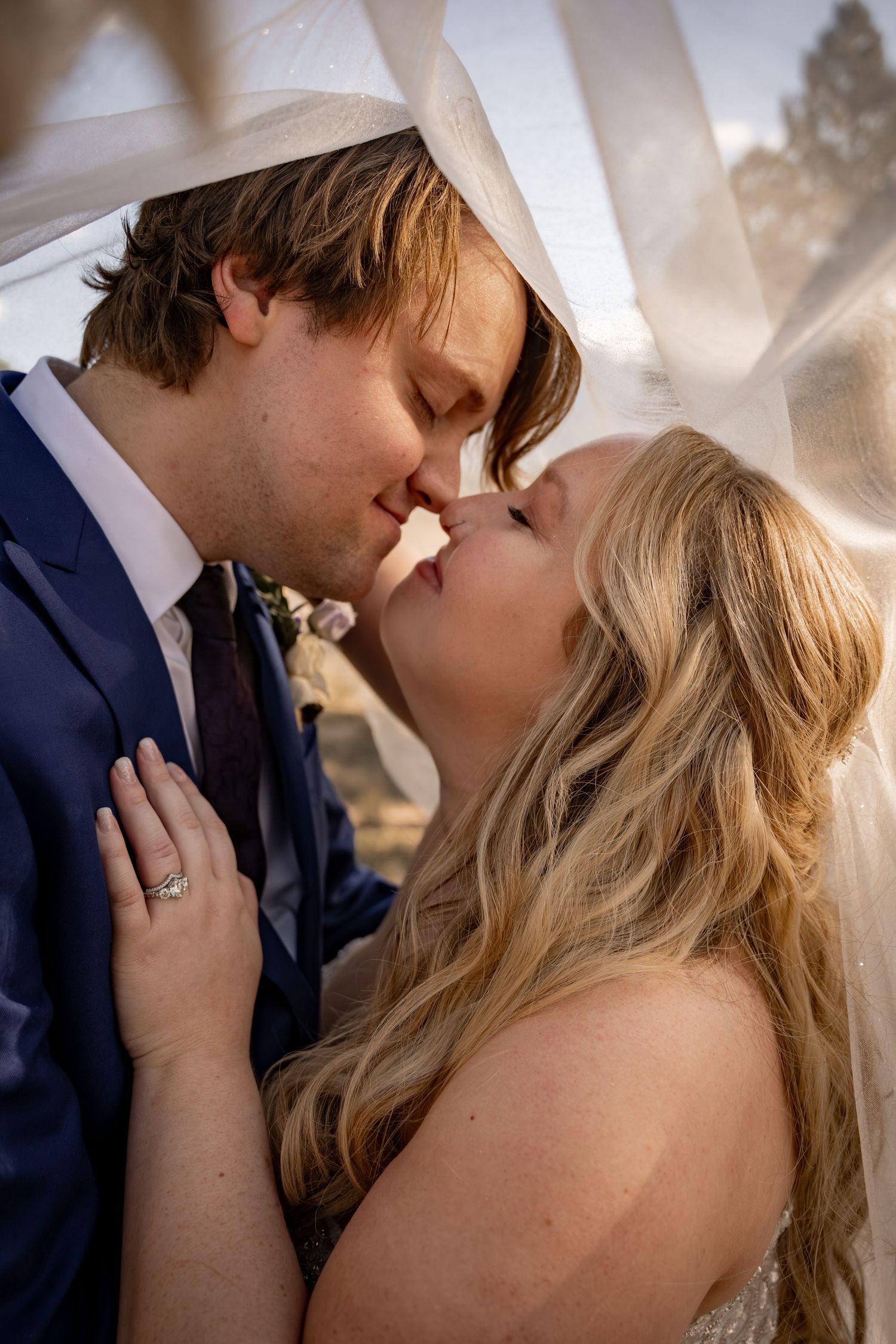 Romantic close-up wedding portraits showing tender moments between the newlyweds.