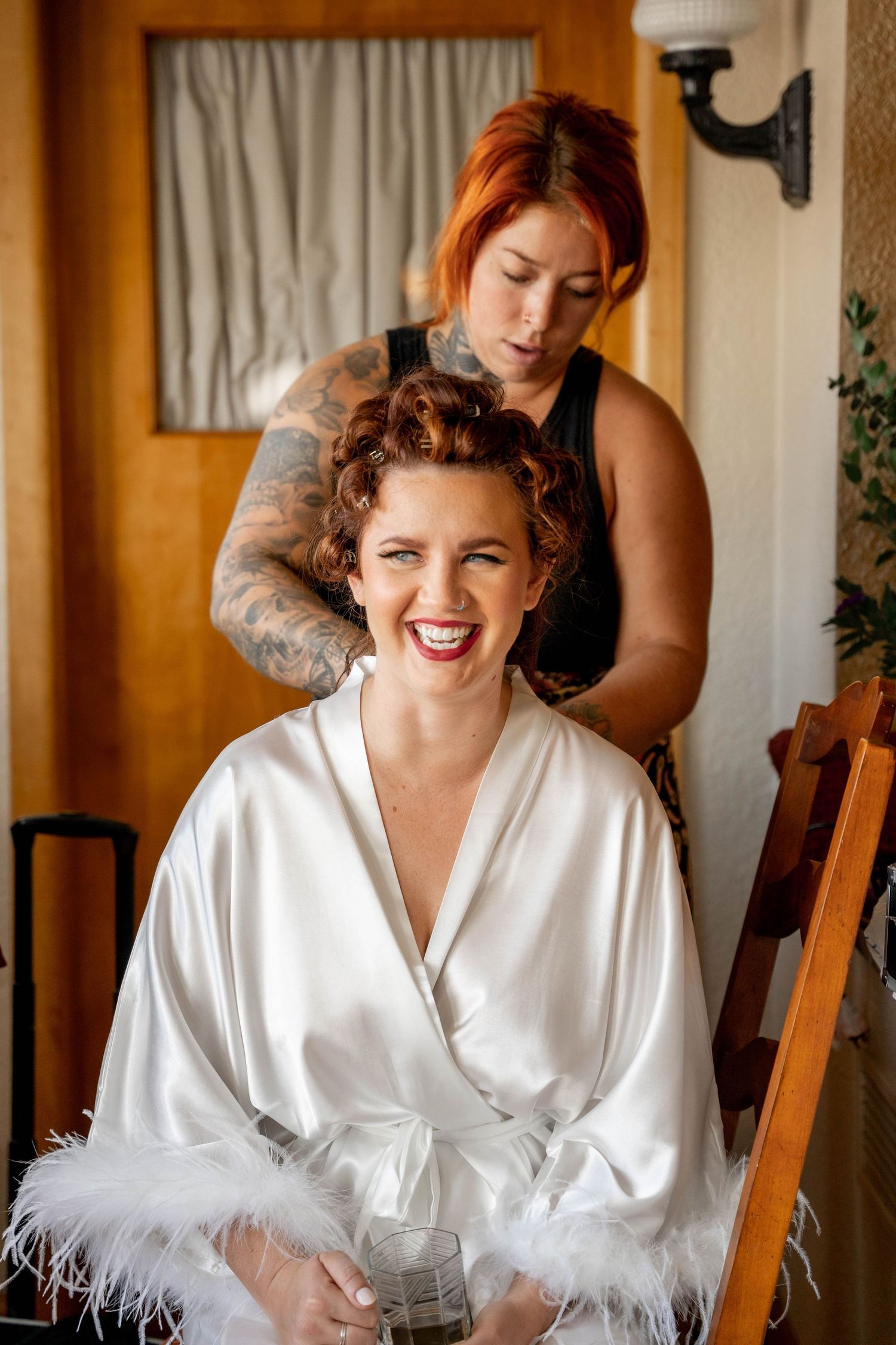 A sequence of three photos showing a person in a white feathered robe laughing and posing expressively.
