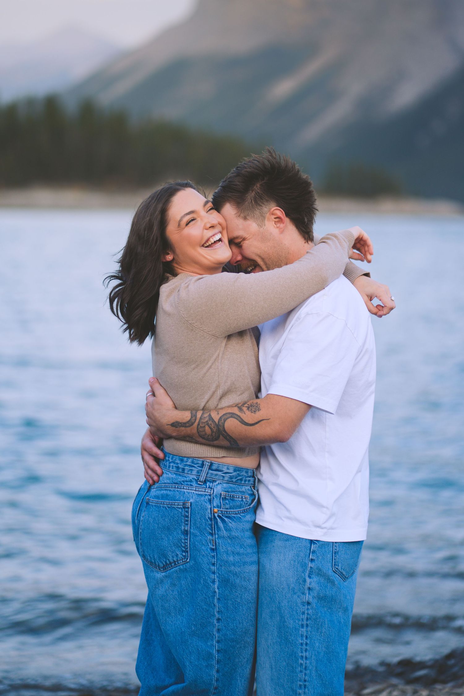 Cheeky whisper in the ear, something to make her laugh, allowing the photographer to capture the real moment