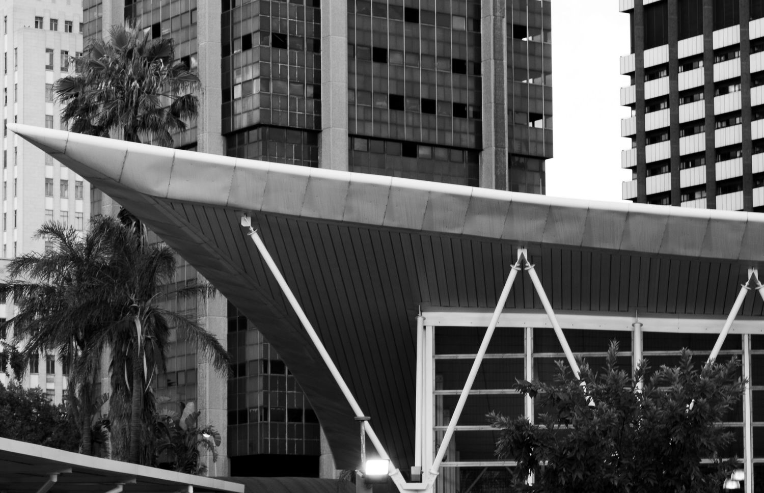 Corner of Park Station Gautrain modern architecture in Johannesburg with buildings in the background.