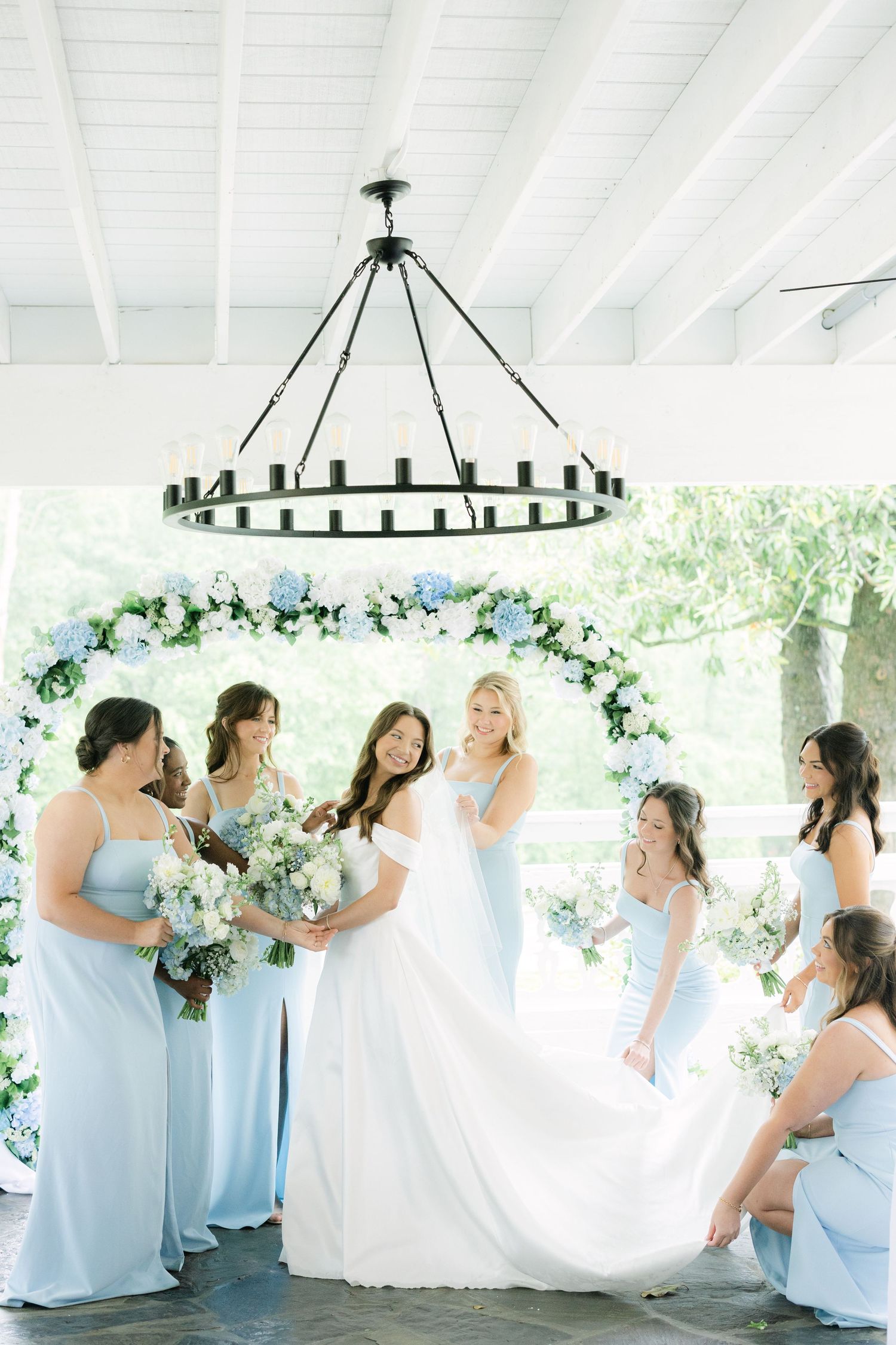 Bride and bridesmaids in light blue dressesd