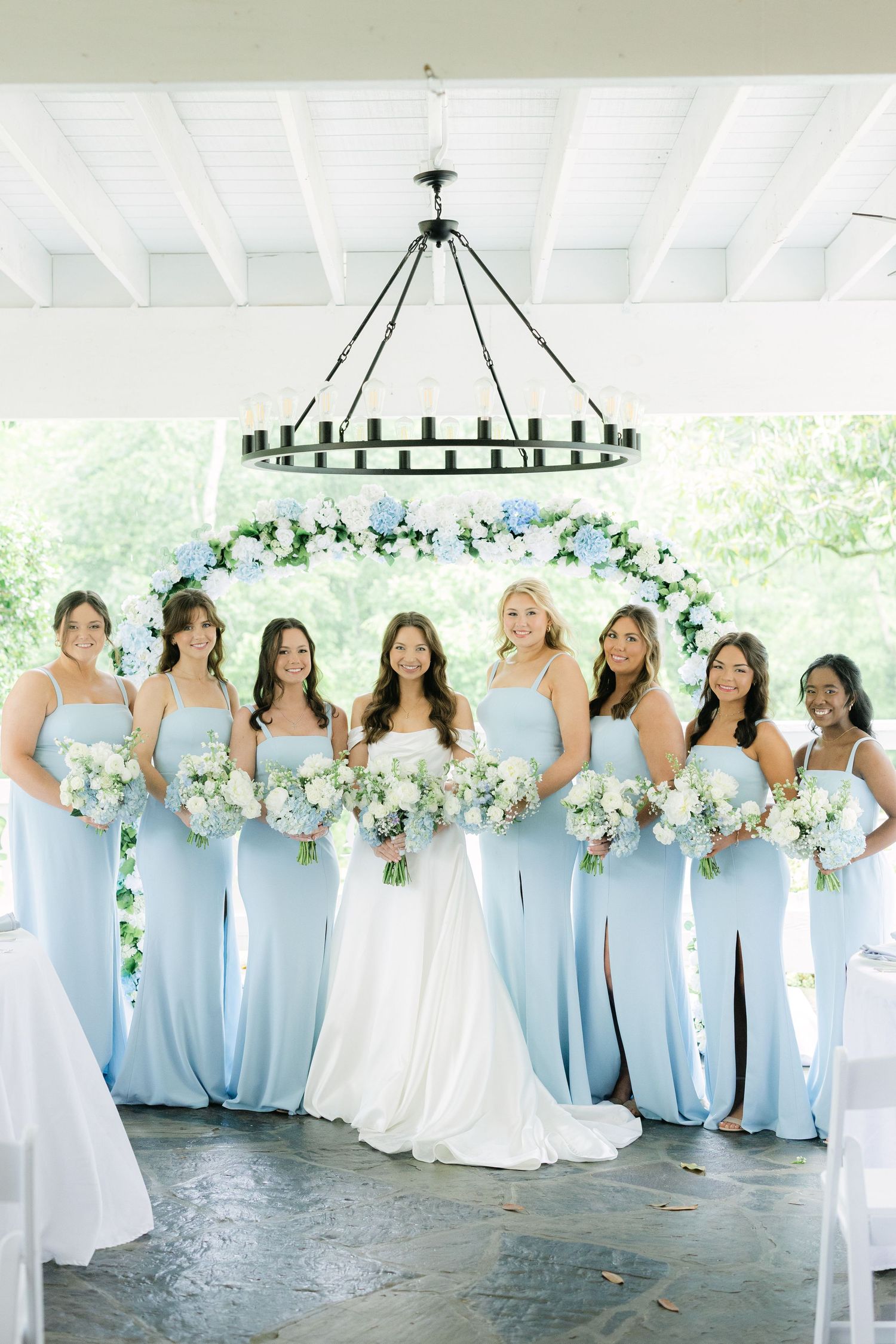 Bride and bridesmaids in light blue dresses