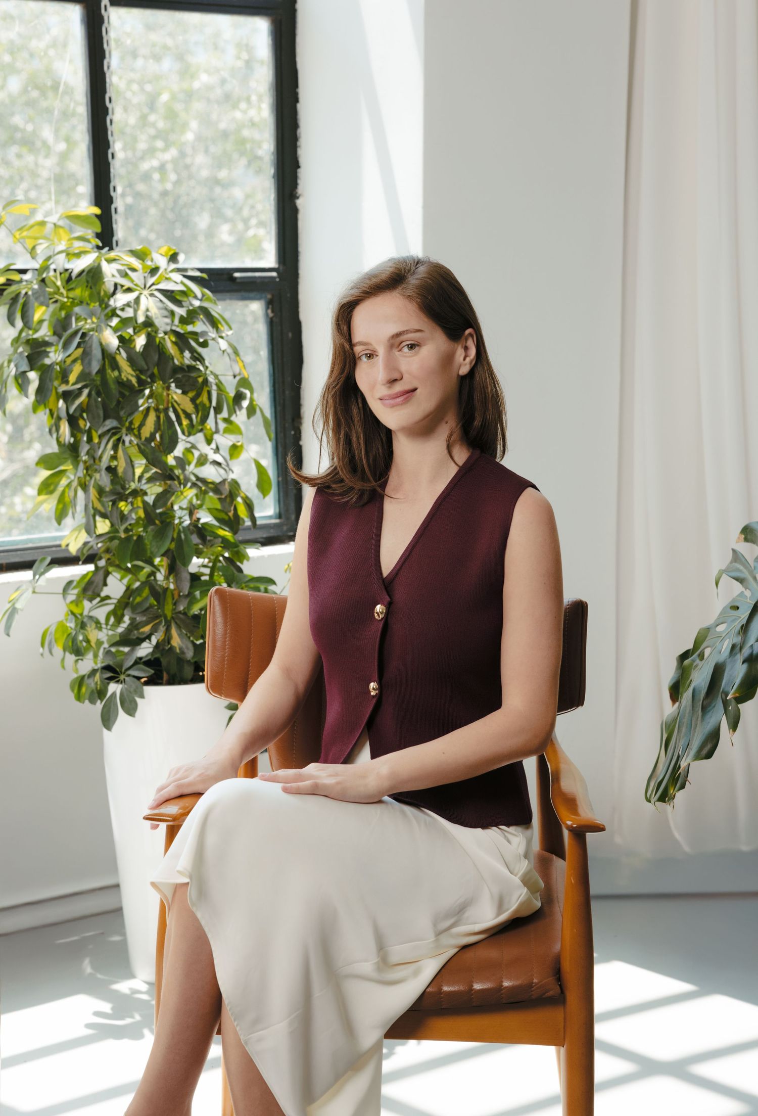 Lifestyle portraits in modern sunlit room with minimalist decor.