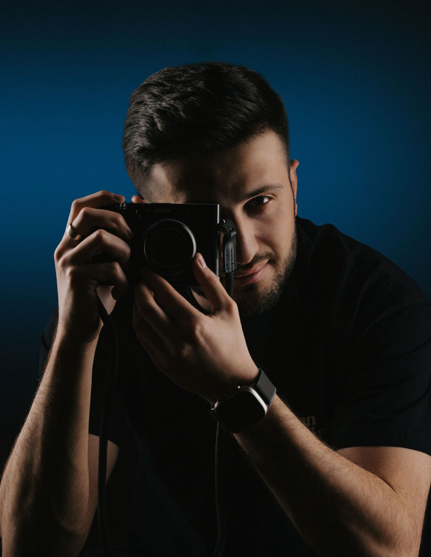 Dramatic portrait series showing silhouette against dark blue background.