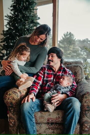 Indoor Christmas lifestyle family photography session with parents and children in Omaha, Nebraska