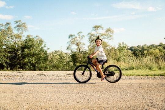 Outdoor family photography session with child on bike in Omaha, Nebraska