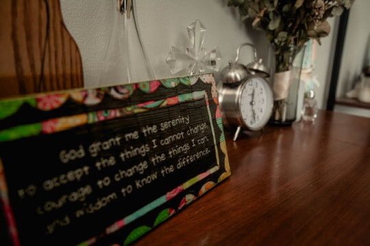 Nursery detail photo with Catholic imagery and Serenity prayer from indoor newborn photography session in Omaha, Nebraska