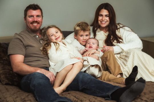 Indoor lifestyle family photography session with parents and children in Omaha, Nebraska