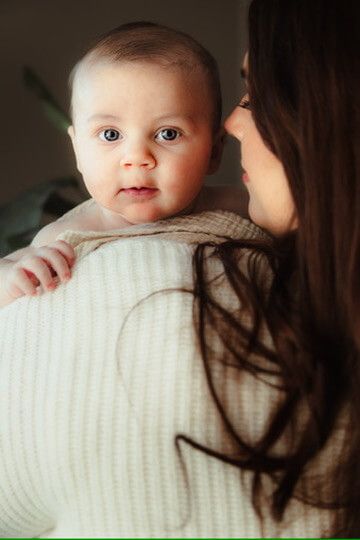 Indoor lifestyle family photography session with mother and baby in Omaha, Nebraska