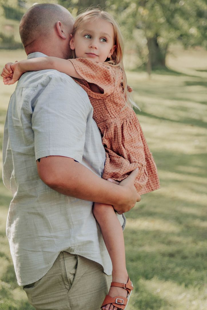 Outdoor family photography session with parents and pre-schooler in Omaha, Nebraska