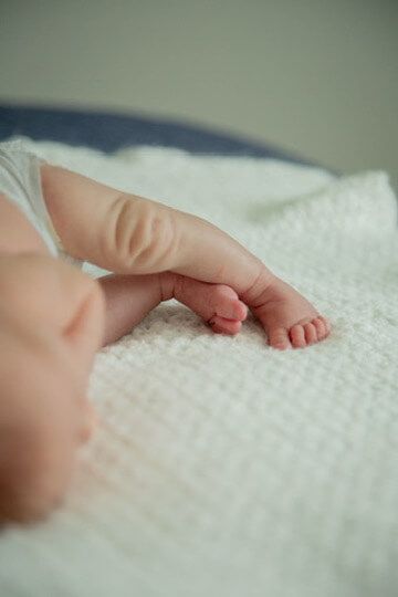 Baby boy toes from newborn lifestyle photography session in Omaha, Nebraska